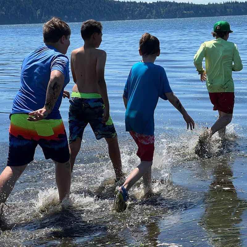 Boys wading in water