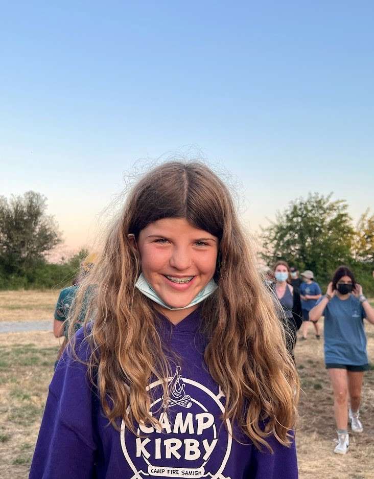 kids next to a camp fire